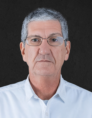 Barne Laureano, man with short gray hair, glasses, neutral expression, Executive Director.