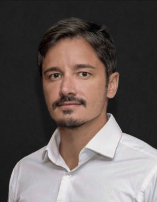 Bernardo Guimarães, with mustache and beard, wearing a white shirt.
