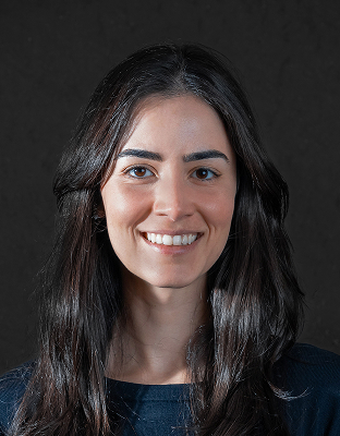 Gabriela Lima, woman with long dark hair, broad smile, Director.
