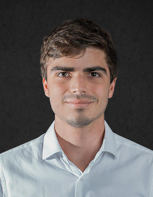 Marcelo Lefevre, man with medium-length dark hair, light stubble, light-colored collared shirt, slight smile, Associate Director.